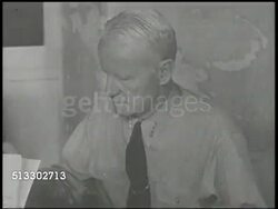 1942: CHESTER W. NIMITZ:  VS United States Navy Commander in Chief U.S. Pacific Fleet Chester Nimitz (1885-1966) & other officers meeting in office, looking over map on table, Nimitz w/ magnifying glass. US Navy, CinCPAC, Fleet Admiral, World War II Instructional Video
