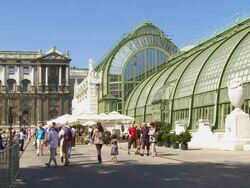 Vienna Hofburg Palace and Palmenhaus (Palm House) in the Burggarten  Stock Footage