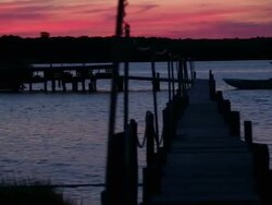 WS PAN Tide Changing Under Fishing Dock / Oyster, Virginia, USA Stock Footage