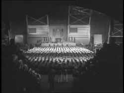 West Point Military Academy cadets throw their hats in the air upon their graduation.\n News Clip