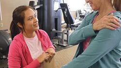 Physical therapist evaluates senior female client Stock Footage
