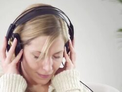 Woman listening music Stock Footage