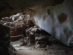 Female explorer is surveying the cave Stock Footage