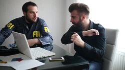 Fbi agent and businessman talking Stock Footage