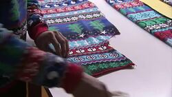 Christmas jumpers factory production line News Clip