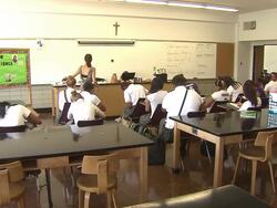 Teacher Instructing In High School Classroom Stock Footage
