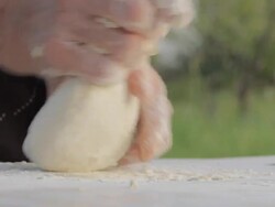 Old wrinkled farmers hands making bread Stock Footage