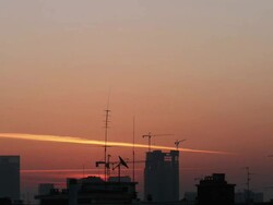 Sunrise over construction site and cranes Stock Footage