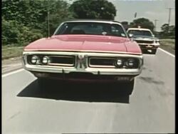 A police officer pulls over a suspect. News Clip