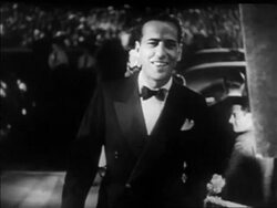 B/W 1930s Humphrey Bogart smiling at Hollywood premiere at Grauman's Chinese Theater / newsreel Stock Footage