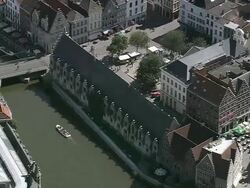 MS AERIAL ZI ZO PAN View of tourist roaming in Gravensteen Castle at Ghent city / Flanders, Belgium Stock Footage