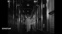 1933: MODERN TRAIN: CU Advertisement for 20th Century Limited line. EXT MS Modern streamliner passing. INT LS Man in passenger car corridor. MS Chefs in kitchen. VS Woman getting manicure, haircut on train. MS Man lighting cigarette for passenger. NY Instructional Video