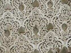 CU TU Shot of ornate facade surrounding keyhole door frames in Madras Bou Inania / Fez, Fes-Boulemane, Morocco Stock Footage