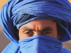 Male in traditional blue Touareg Headress, Sahara Morocco Africa Stock Footage