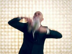 Man with money in front of lightwall Stock Footage