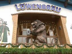 beer tent "LÃƒÂ¶wenbrÃƒÂ¤u" outside, decoration figure a lion Stock Footage