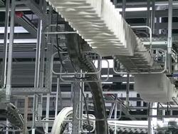 MS Shot of conveyer belts at newspaper printing office / Russelheim, Hesse, Germany Stock Footage
