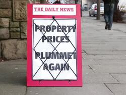 Newspaper headline Board - Property Prices Plummet Again Stock Footage