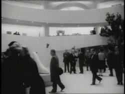 Visitors walk through the Guggenheim Museum designed by Frank Lloyd Wright. News Clip