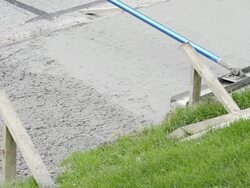 CU Shot of Workman using float to smooth fresh concrete / Valparaiso, Indiana, United States Stock Footage