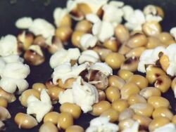 popping popcorn kernels Stock Footage