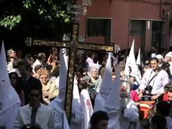 Nazarenos parade during the celebration of Semana Santa a Holy week in Malaga Spain, Europe Stock Footage