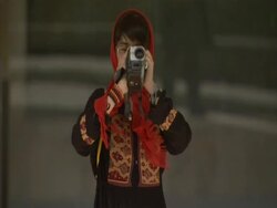 Young woman in traditional Persian dress pointing camcorder at camera, Iran (sound available) Stock Footage