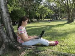 Young lady using laptop Stock Footage
