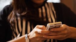 girl chatting by using smart phone in the cafe Stock Footage