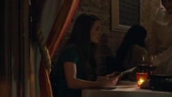 Waitress goes over menu with dining couple in upscale restaurant Stock Footage