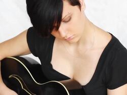 Beatiful girl playing acoustic guitar. Stock Footage