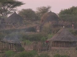 Long Shot static - Wisps of smoke drift through an Ethiopian village. / Ethiopia Stock Footage