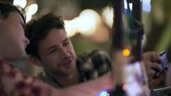 Young couple taking selfies in Austin bar crack up laughing Stock Footage