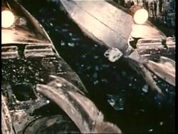 Coal moves along a conveyor belt. News Clip