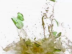MS SLO MO Bottle of beer exploding and splashing / vieux pont en auge, Normandy Stock Footage