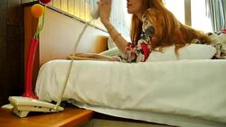 Woman reading in bed Stock Footage