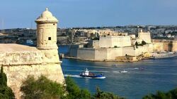 Boats and a ship entering the Grand Harbour Stock Footage