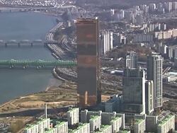 WS AERIAL ZI View of Cityscape of Seoul landmark 63Building in Yeouido Business District and Hangang River / Seoul, South Korea Stock Footage