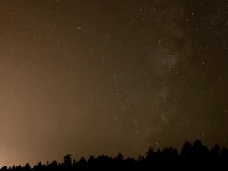 WS T/L ZI Milky Way moving across sky over forest / Flagstaff, Arizona, United States Stock Footage
