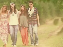 Group of hippie friends walk by Stock Footage