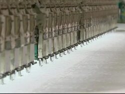 Textile workers working in clothing factory News Clip