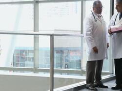 WS Two physicians are talking over a patient chart / Seattle, Washington, USA Stock Footage