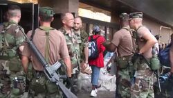 Families are loaded onto busses Stock Footage