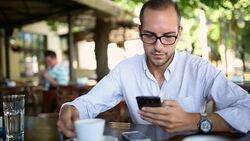 Reading message on smart phone Stock Footage