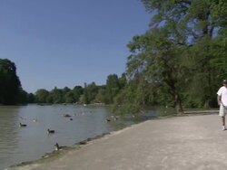 Englischer Garten - Seehaus, Biergarten, many people, ducks on lake Stock Footage
