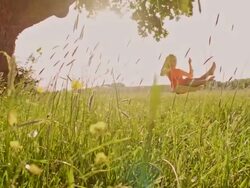 SLO MO Young girl swinging in the nature Stock Footage