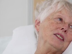 CU PAN Patient in Hospital Bed Listening to Medical Worker / Richmond, Virginia, United States Stock Footage