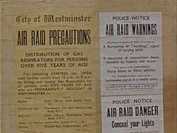 1939 Close-up City Of Westminster air raid signs reading 'Air Raid Precautions', 'Air Raid Warnings' and 'Air Raid Danger' posted during war preparations / Westminster, London, England  Stock Footage
