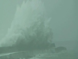 Huge wave crashes over sea wall; Typhoon Jangmi, Taiwan, 28th September 2008 (With Audio) Stock Footage