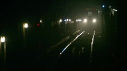A subway train operates in a lit tunnel. Stock Footage